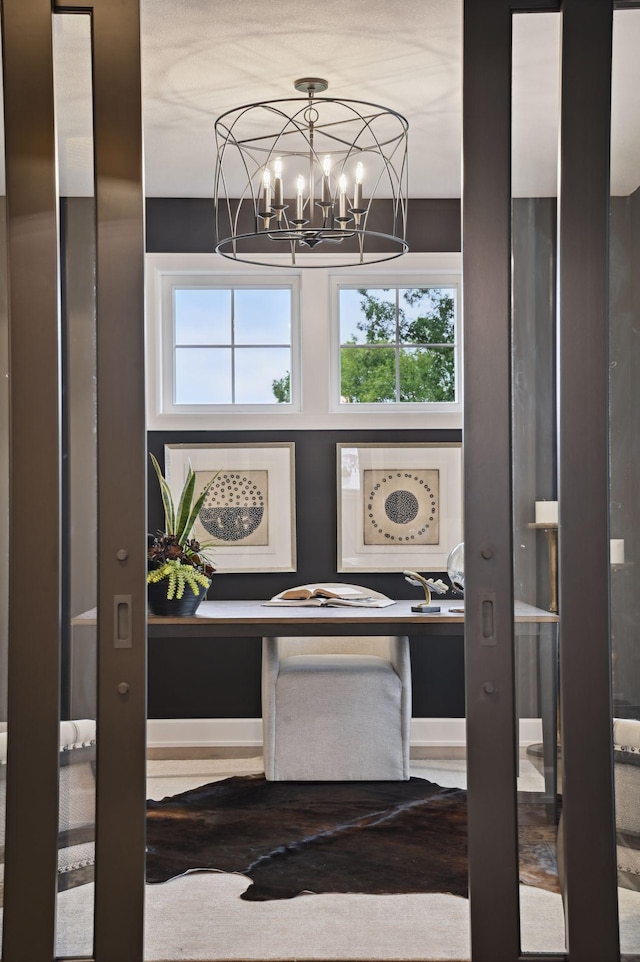 room details with a notable chandelier and hardwood / wood-style flooring