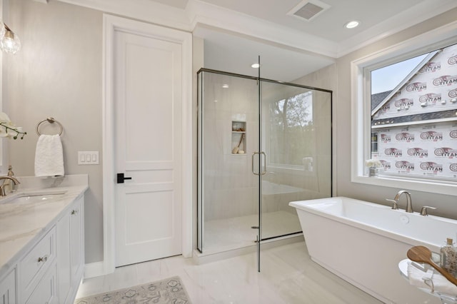 bathroom with separate shower and tub, tile floors, and vanity