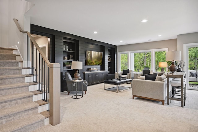 living room with a wealth of natural light and light colored carpet