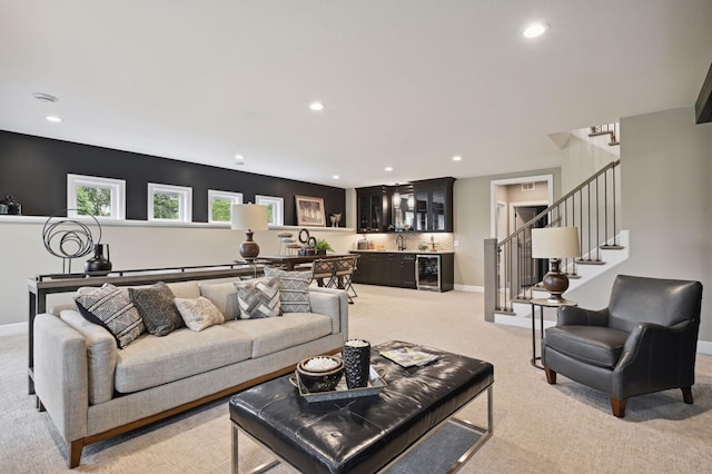 carpeted living room featuring sink