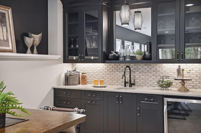 bar with wine cooler, backsplash, and sink