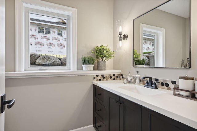 bathroom featuring a wealth of natural light and vanity