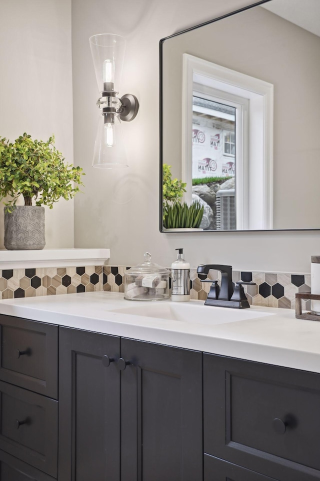 bathroom featuring backsplash and vanity