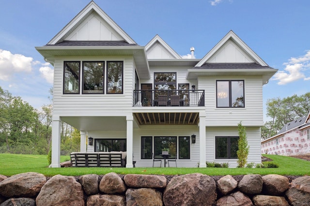 rear view of property with a balcony