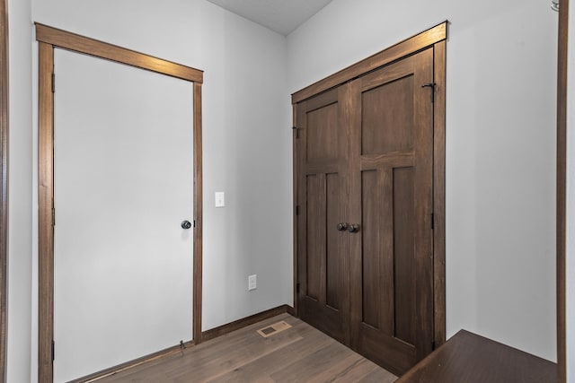 foyer entrance featuring dark wood-type flooring