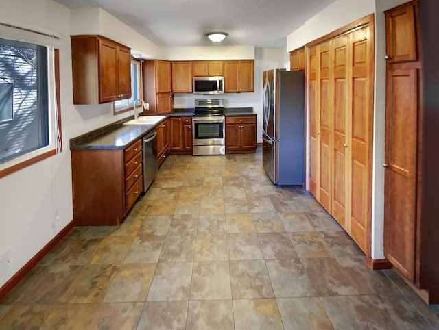 kitchen with sink and appliances with stainless steel finishes