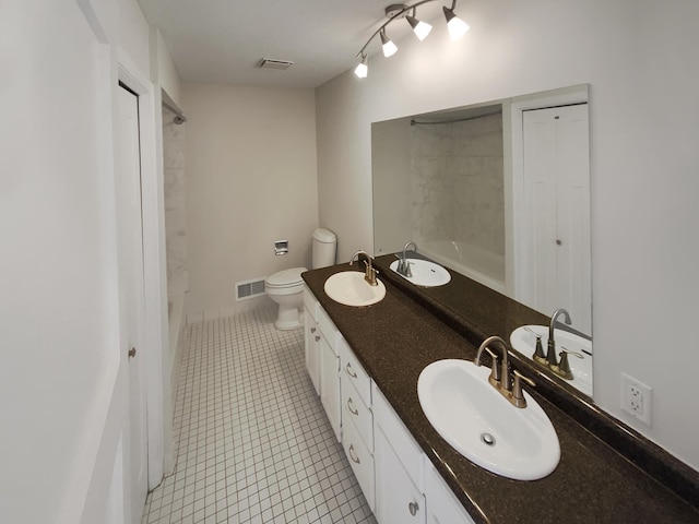 full bathroom featuring shower / bathing tub combination, tile patterned flooring, vanity, and toilet