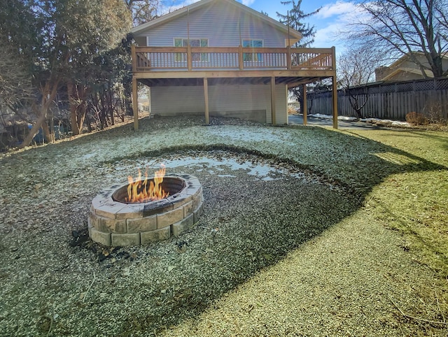 exterior space featuring a fire pit and a deck