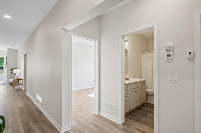 hallway featuring light wood-type flooring