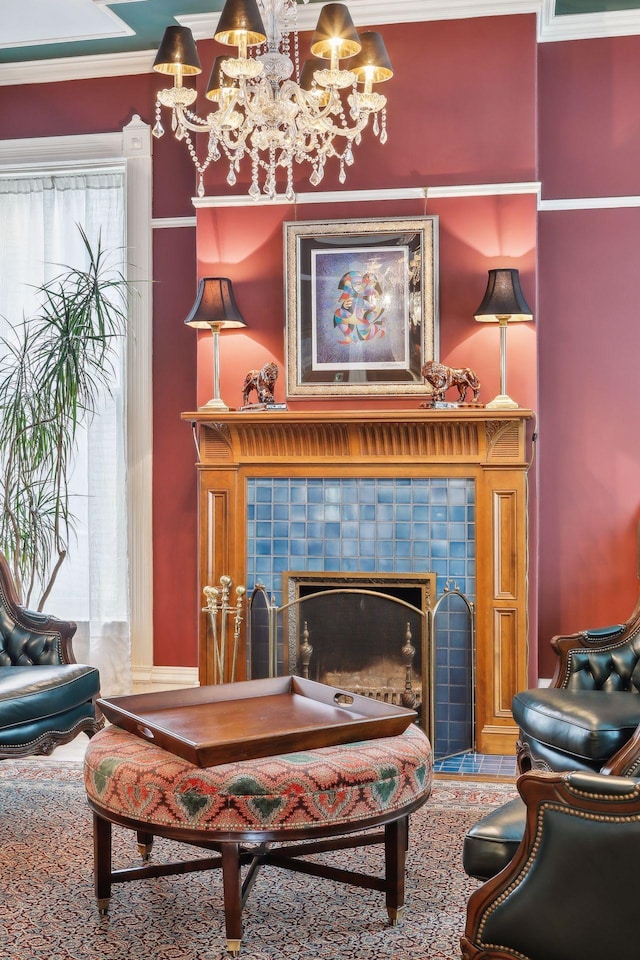 living room featuring a fireplace, crown molding, and a notable chandelier