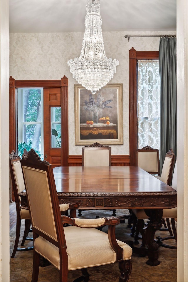 dining space featuring a notable chandelier