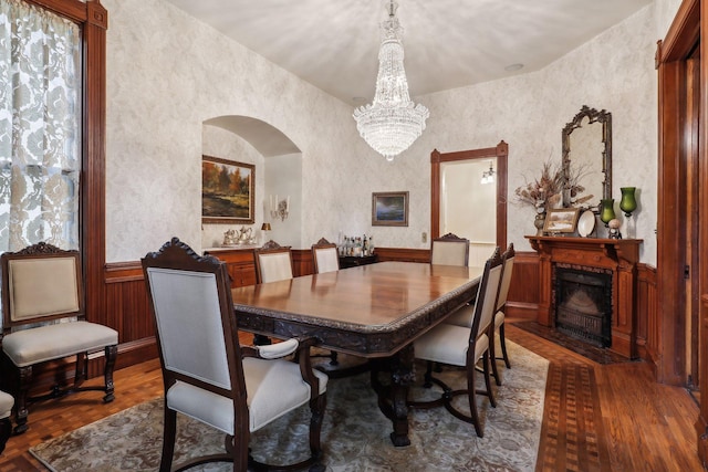 dining area with a chandelier and dark wood-type flooring