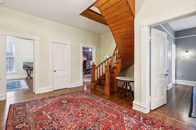 foyer featuring dark wood-type flooring