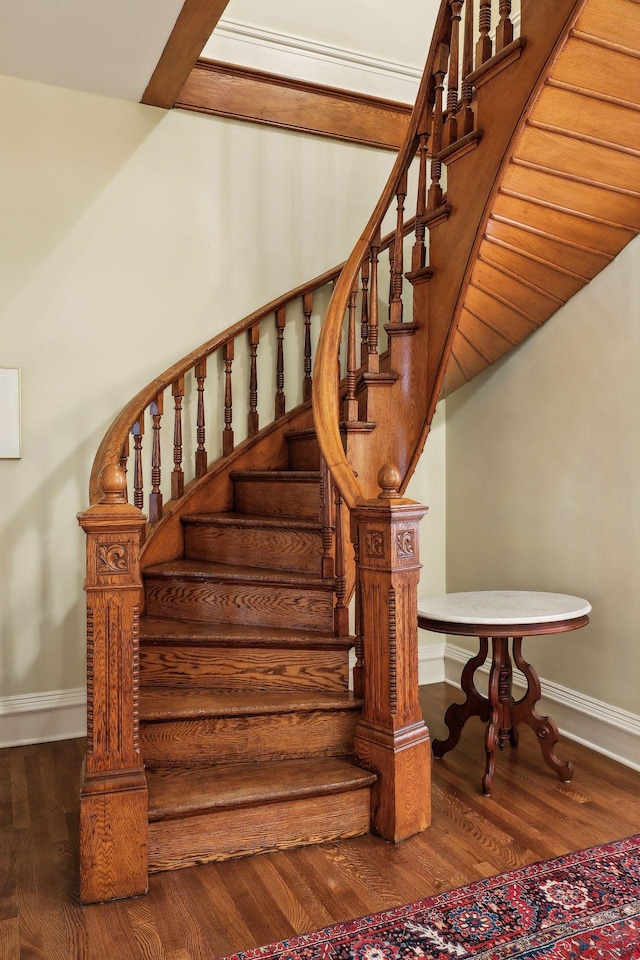 staircase featuring hardwood / wood-style floors