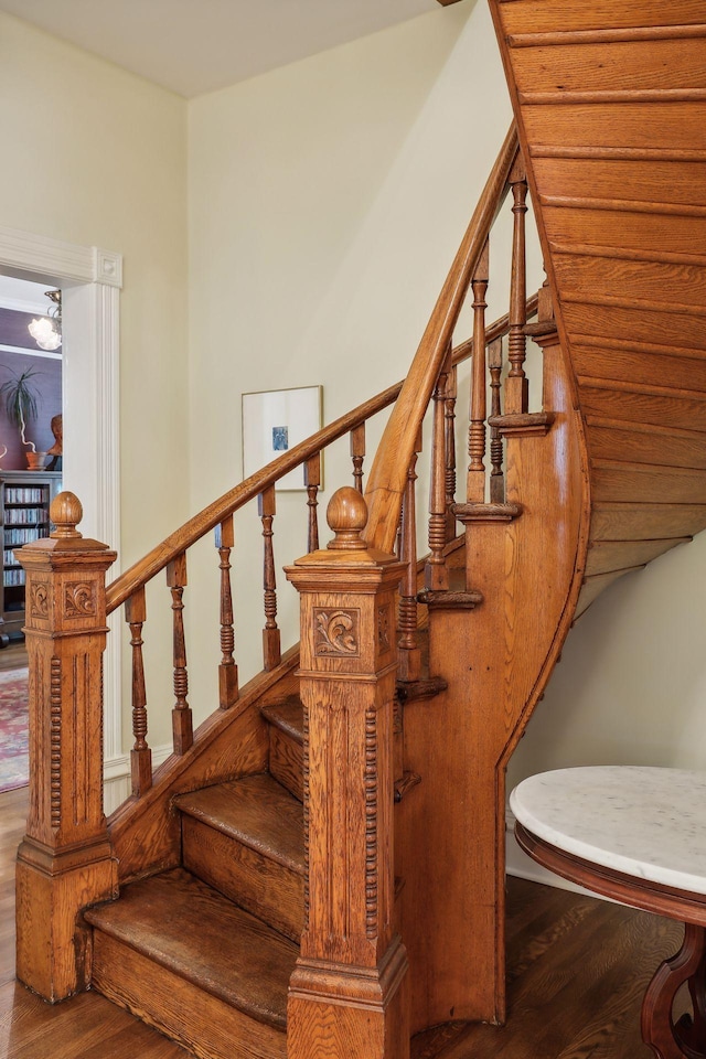 stairway featuring hardwood / wood-style flooring