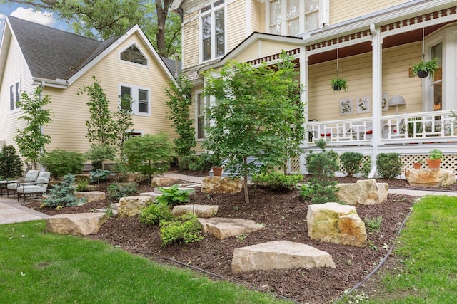 view of yard with covered porch