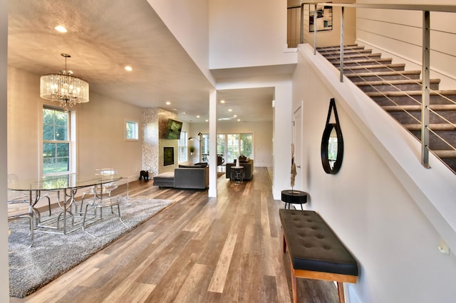 foyer with a chandelier and hardwood / wood-style floors