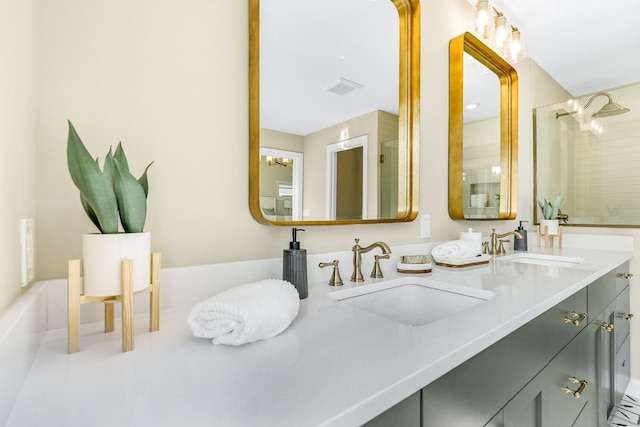 bathroom with a shower and vanity