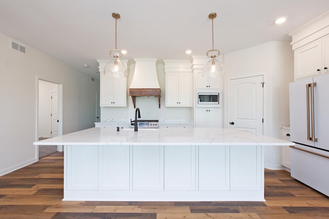 kitchen with white refrigerator, white cabinets, dark hardwood / wood-style floors, and custom exhaust hood