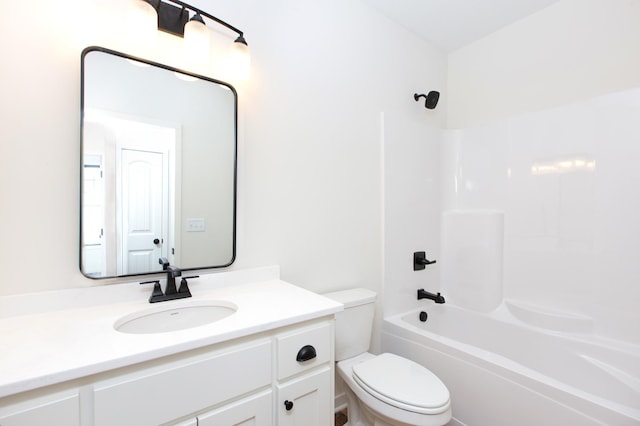 full bathroom with toilet, large vanity, and bathtub / shower combination