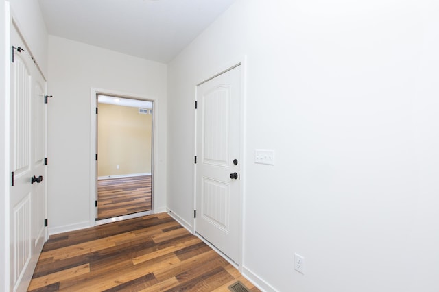 hall featuring dark hardwood / wood-style flooring