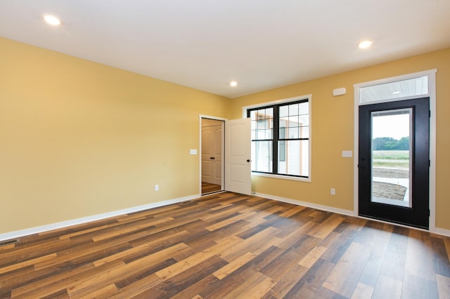 foyer entrance with dark hardwood / wood-style floors