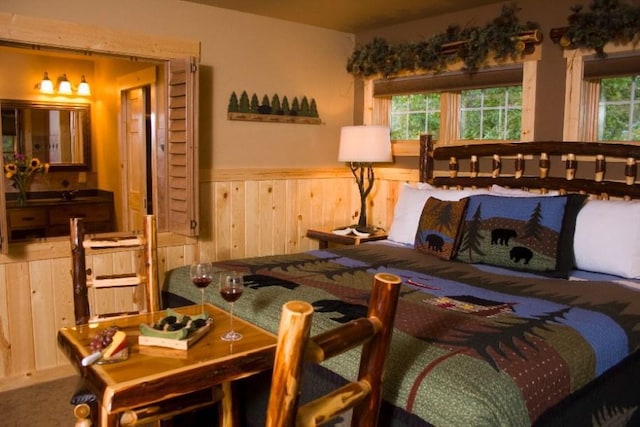 bedroom featuring carpet flooring and multiple windows