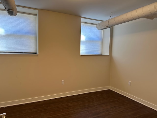 spare room featuring dark hardwood / wood-style floors