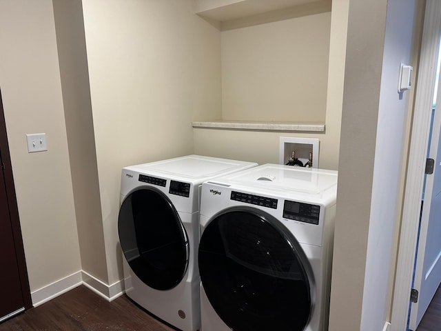 laundry area featuring washer and clothes dryer and dark hardwood / wood-style floors