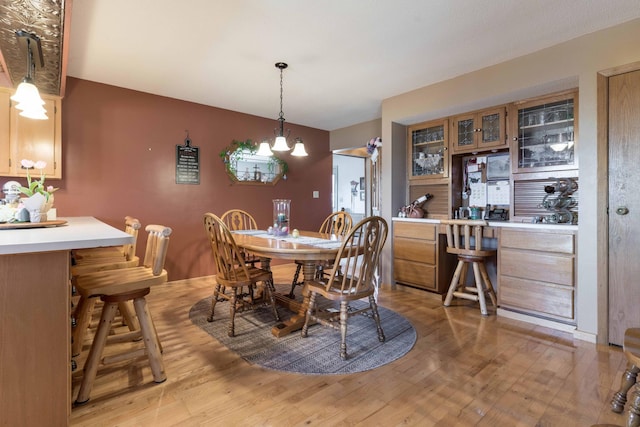 dining room featuring light hardwood / wood-style floors and an inviting chandelier