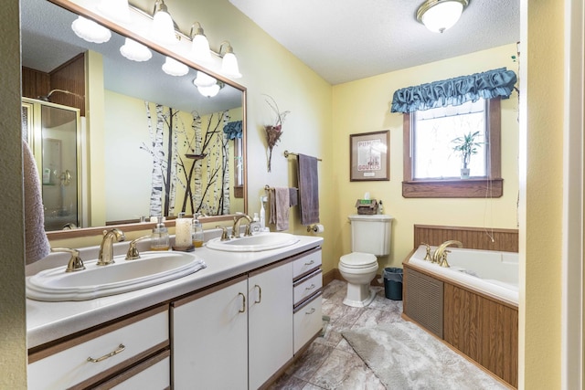 full bathroom featuring plus walk in shower, vanity, a textured ceiling, and toilet