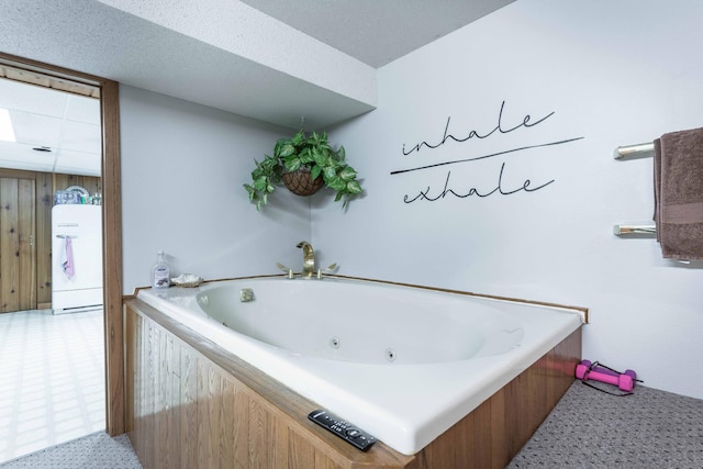 bathroom with a bathing tub and wood walls