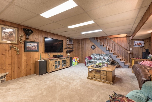 living room with carpet flooring and a drop ceiling