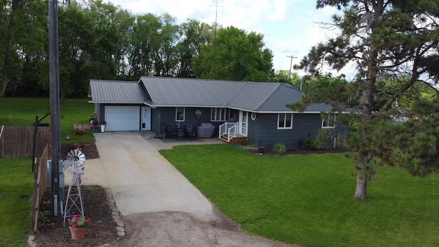 single story home featuring a front yard and a garage