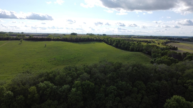 birds eye view of property with a rural view