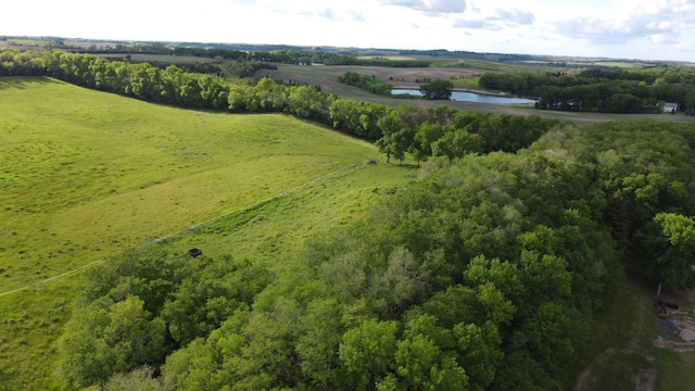 aerial view with a water view and a rural view