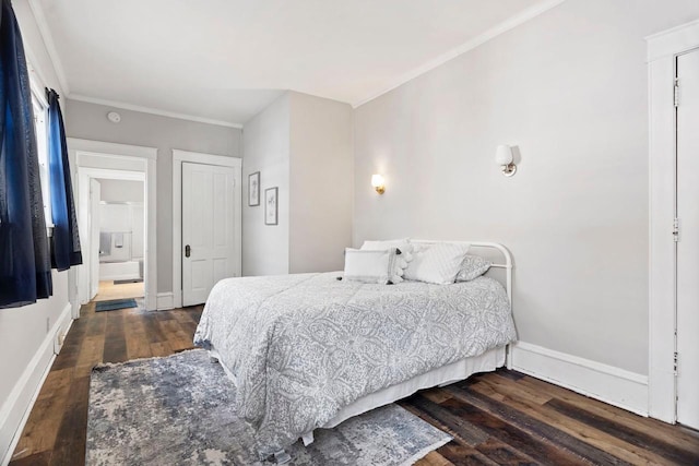 bedroom featuring ornamental molding, a closet, and dark hardwood / wood-style floors