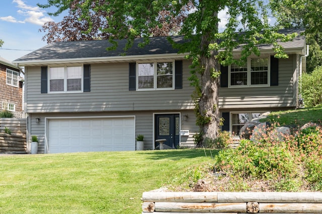 view of front of house with a garage and a front yard