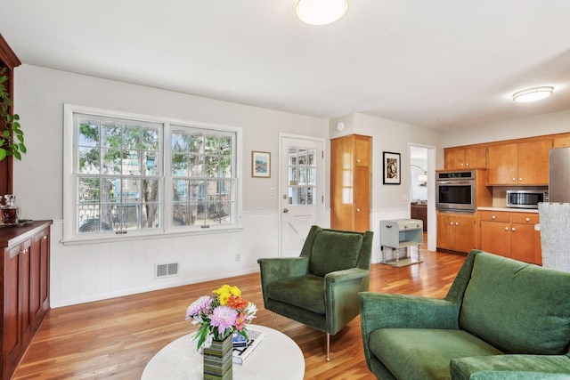 living room with light hardwood / wood-style floors