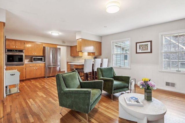 living room with light hardwood / wood-style floors