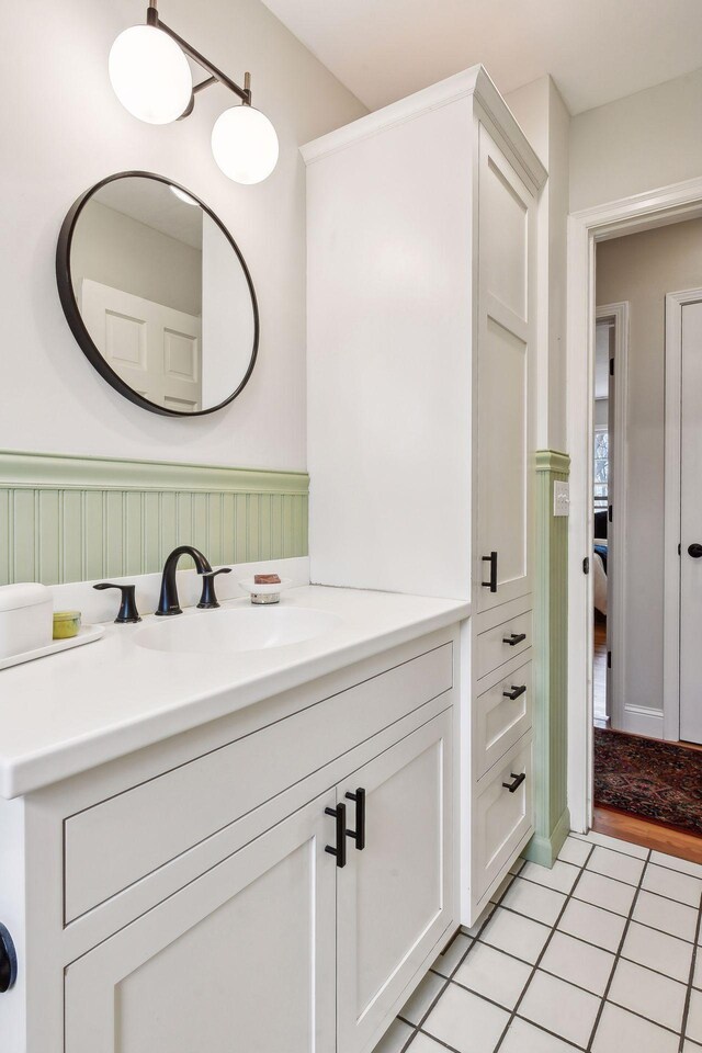 bathroom with tile floors and vanity