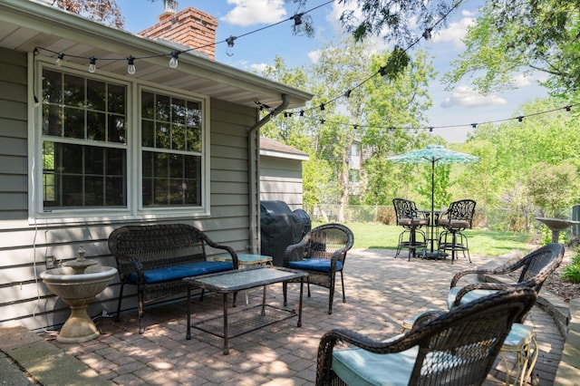 view of terrace with outdoor lounge area and grilling area