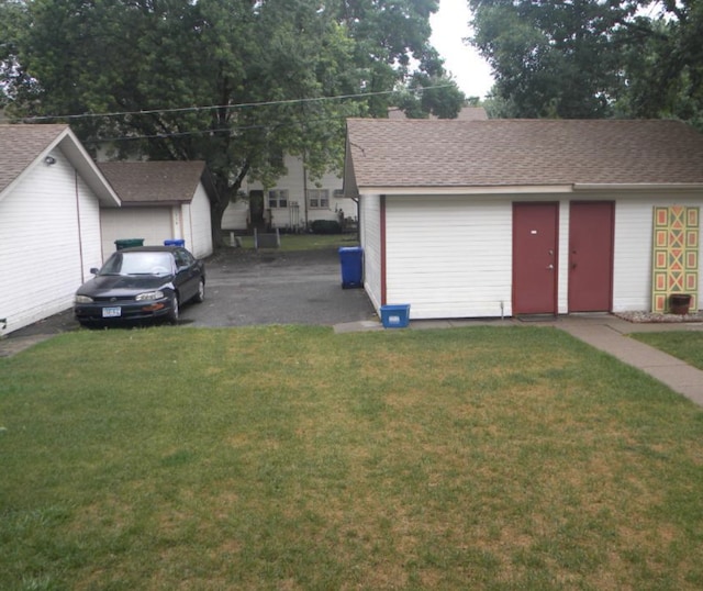 garage with a lawn