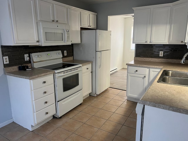 kitchen with white appliances, ceiling fan, sink, white cabinets, and light tile patterned flooring