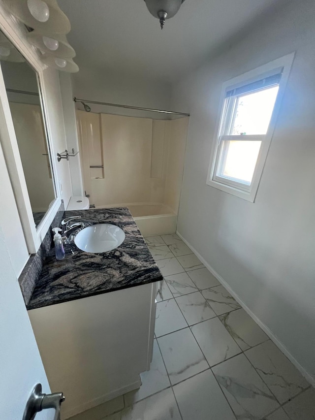 bathroom featuring vanity and washtub / shower combination