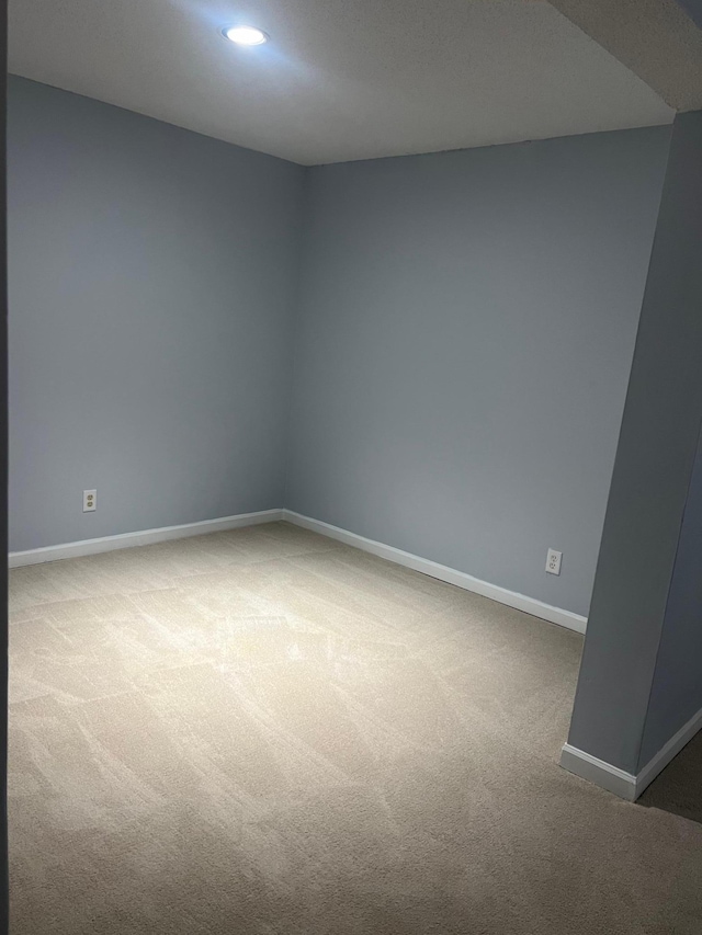 spare room featuring carpet flooring