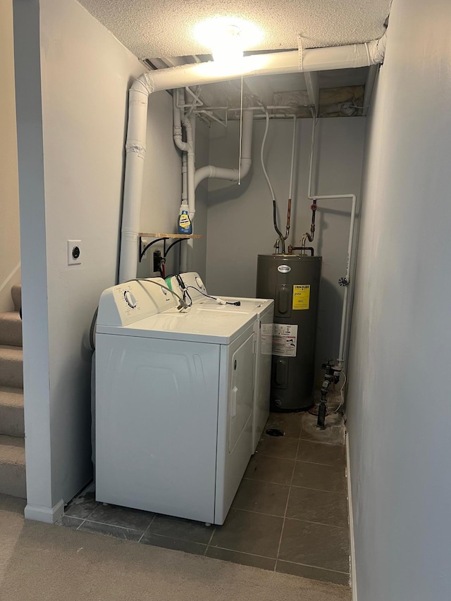 laundry room with washing machine and dryer and electric water heater