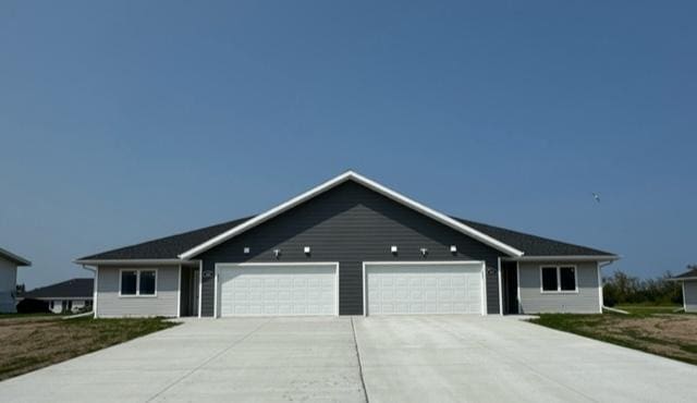 ranch-style home with a garage