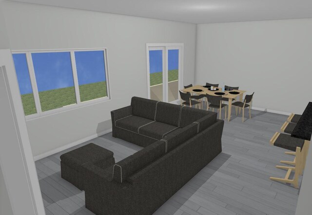 living room with light wood-type flooring and a healthy amount of sunlight