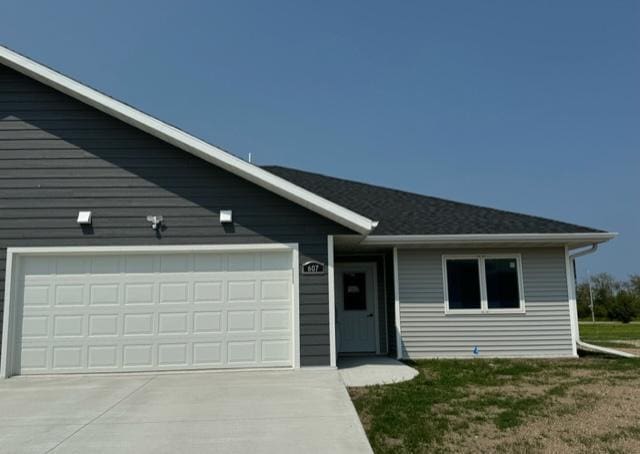 ranch-style house featuring a garage